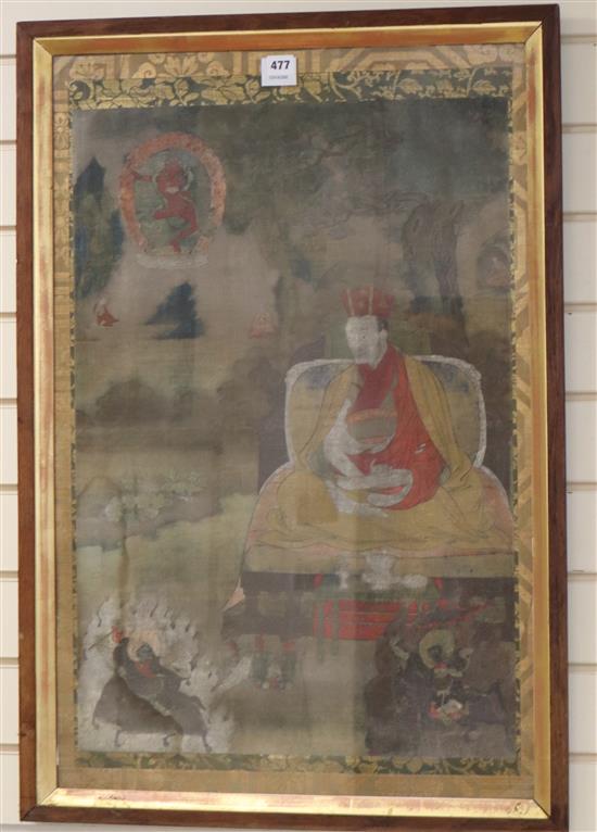 A Tibetan thangka decorated with a nobleman surrounded by demons, 73 x 50cm